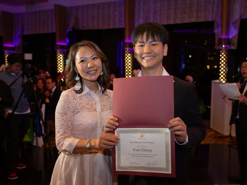 Ivan Chiang holding his China AIDs Fund Scholarship certificate at the Celebrating Life 2024 Gala.