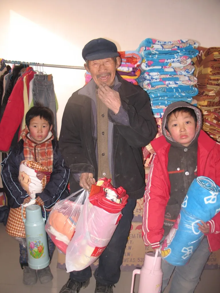 A grandfather and the children in his care, Henan children's center.
