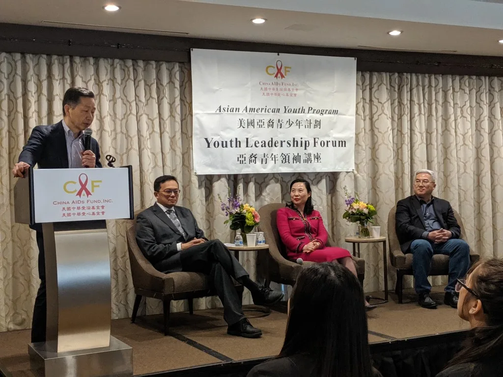 A speaker addressing the room from the podium at the Asian American Youth Program Youth Leadership Forum.